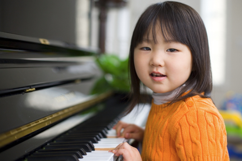young girl at a piano