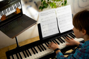 Boy,Learning,To,Play,The,Piano,In,Distance,Learning,Via
